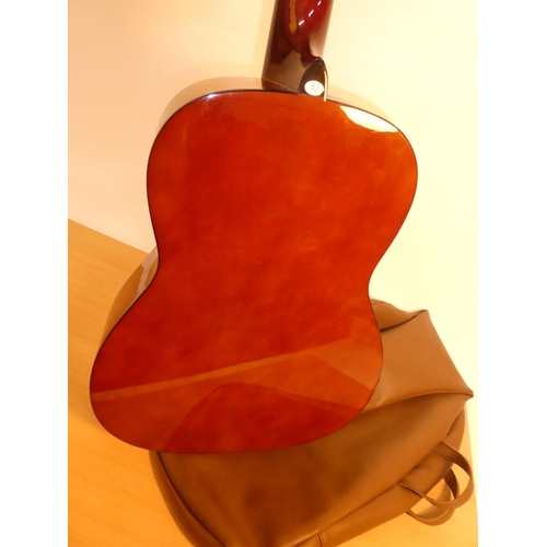 674 - A stunning Stagg handmade wooden classical guitar, model 0530 and bag.