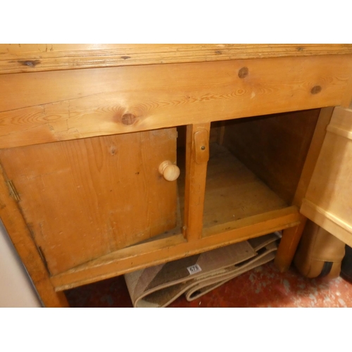 677 - An antique pine storage cupboard with writing slope, measures 22.5