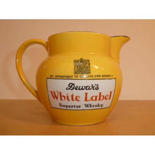 693 - A vintage John Maddock & Sons 'Dewar's White Label' whisky jug (a/f).