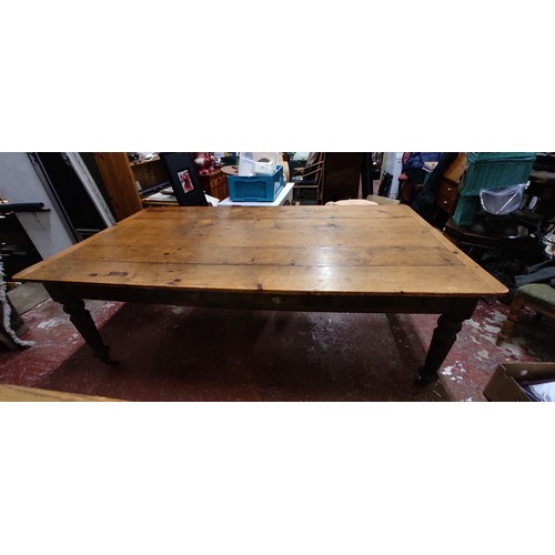 700 - A large stunning antique Irish pine farmhouse table, measuring 82