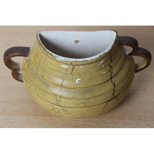 128 - A vintage Lilian Bolton pottery wall pocket.