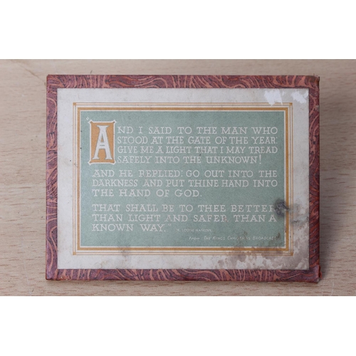 129 - A card desk plaque of a religious verse.