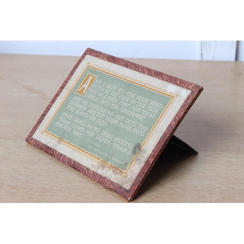 129 - A card desk plaque of a religious verse.