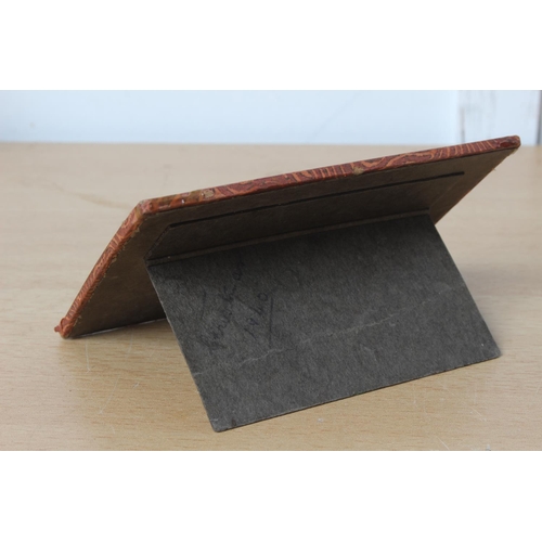 129 - A card desk plaque of a religious verse.