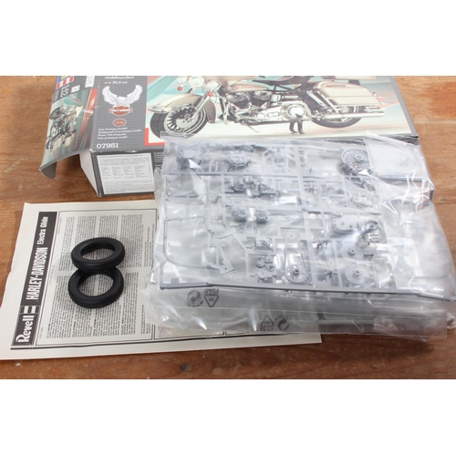 101 - A Revell Harley Davidson - Electra Glide model kit and book.