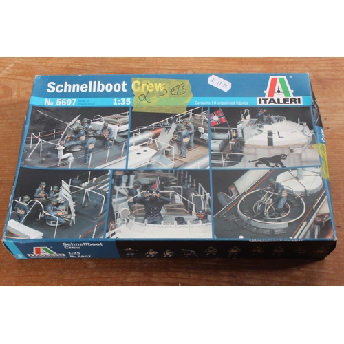 105 - A boxed Italeri Schnellboot Crew model kit.
