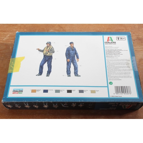 105 - A boxed Italeri Schnellboot Crew model kit.