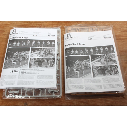 105 - A boxed Italeri Schnellboot Crew model kit.