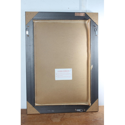 75 - A gilt framed rectangular wall mirror.