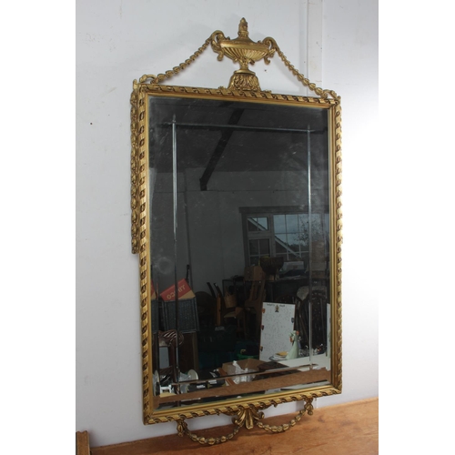 76 - A stunning gilt framed wall mirror with bevelled glass detail.