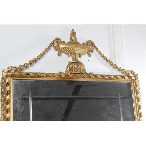 76 - A stunning gilt framed wall mirror with bevelled glass detail.
