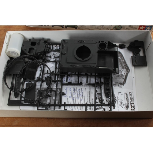 582 - A boxed Tamiya M113A1 Fire Support Vehicle model kit.