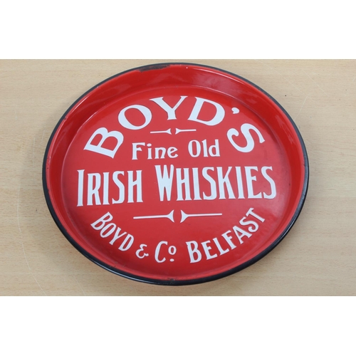 A rare vintage red enamel 'Boyd's Fine Old Irish Whiskies - Boyd & Co Belfast' pub tray.