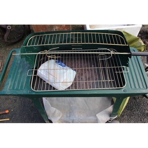 5 - A large BBQ with cover.