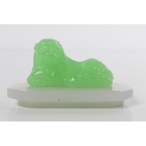 100 - An Antique/ Art Deco Uranium glass lion.