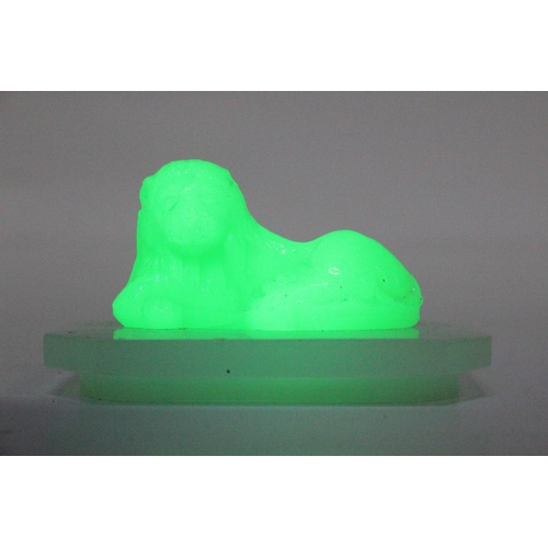 100 - An Antique/ Art Deco Uranium glass lion.