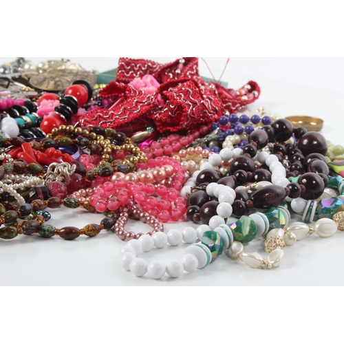 73 - A large lot of assorted costume jewellery and more.