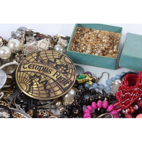 73 - A large lot of assorted costume jewellery and more.