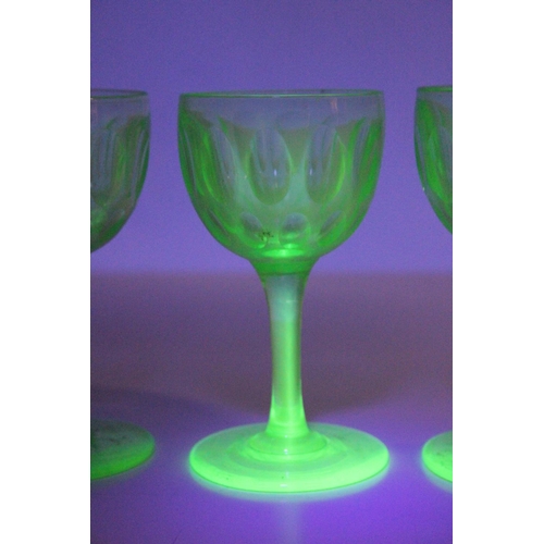 93 - A set of four vintage uranium liqueur glasses.