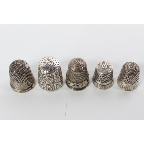 104 - Five Sterling Silver thimbles, one decorated on top 'PE 800 Deluxe'.