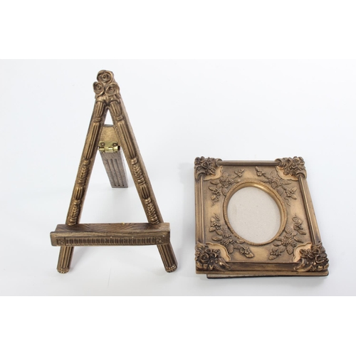 112 - A decorative picture frame and easel stand.