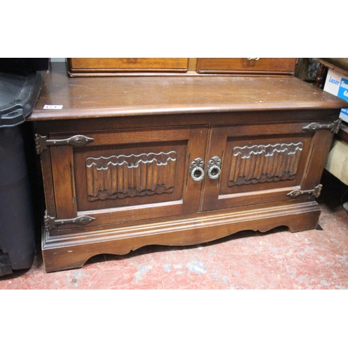 151 - A vintage oak Old Charm two door cabinet.