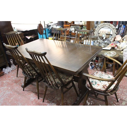 175 - A stunning vintage Ercol dining room table and six chair set.