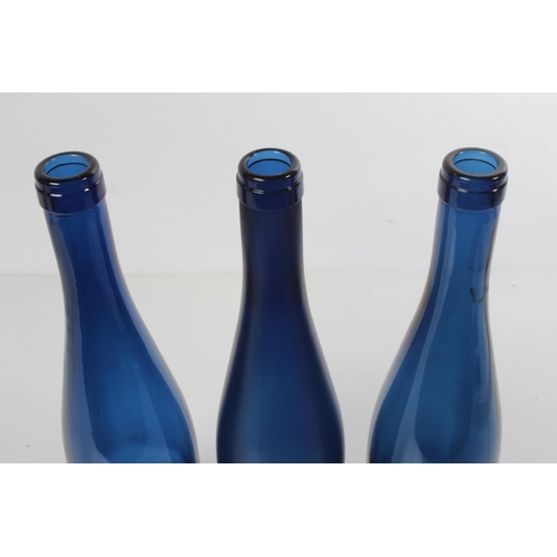 199 - Three blue glass bottles.