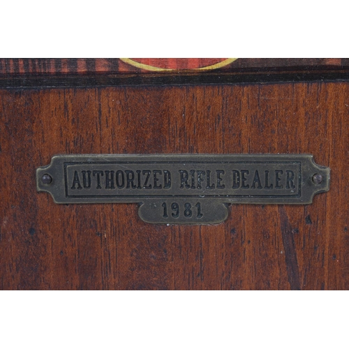 205 - A wooden 'Authorized Rifle Dealer 1981' wall plaque.