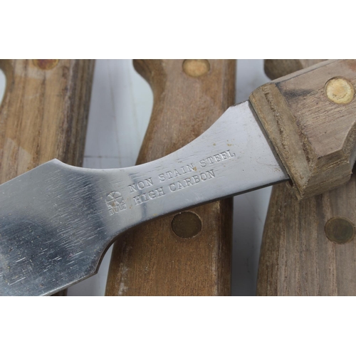 284 - A vintage wooden wall bracket with 4 egg cups, fork and spoon and other kitchen utensils.