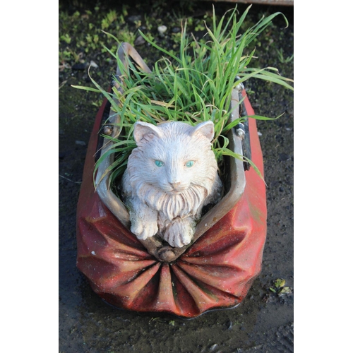 15 - A garden planter modelled as a cat in a bag.