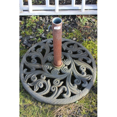 17 - A cast metal parasol stand.