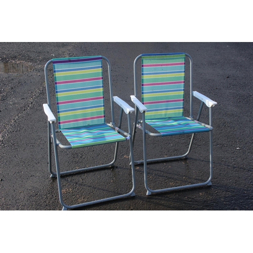 29 - Two folding deck chairs.