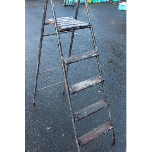 31 - A vintage metal framed step-ladder.