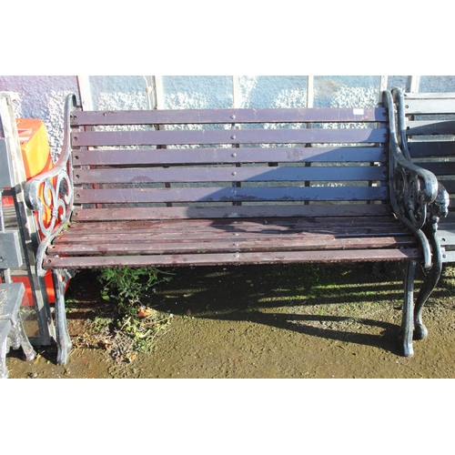 36 - An antique garden bench with cast metal ends.