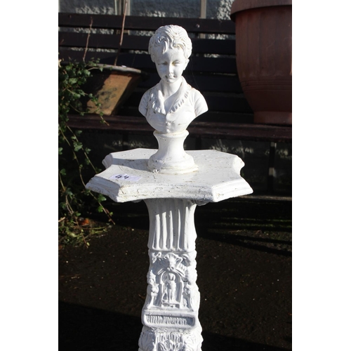 44 - An unusual pedestal bust with decorative details.