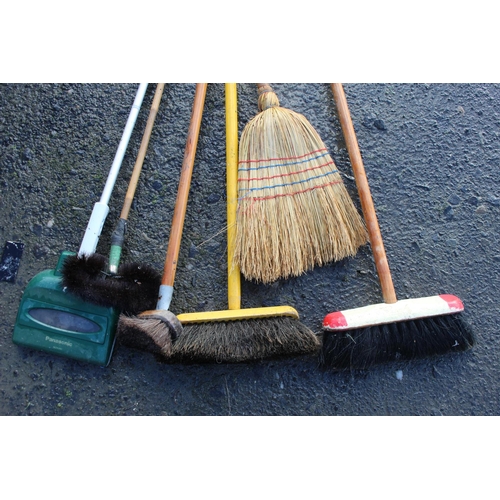 6 - An assortment of brushes and brooms.