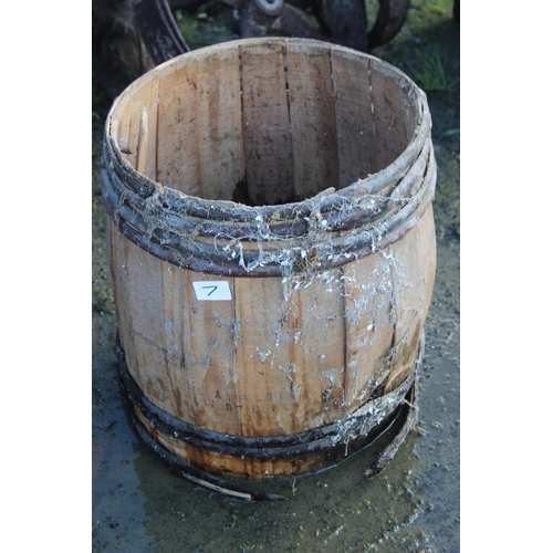 7 - An antique wooden barrel, in need of restoration.