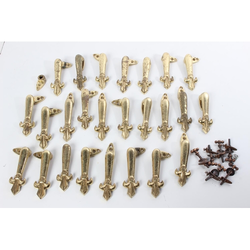 74 - A lot of antique brass stair rod clips & handles.