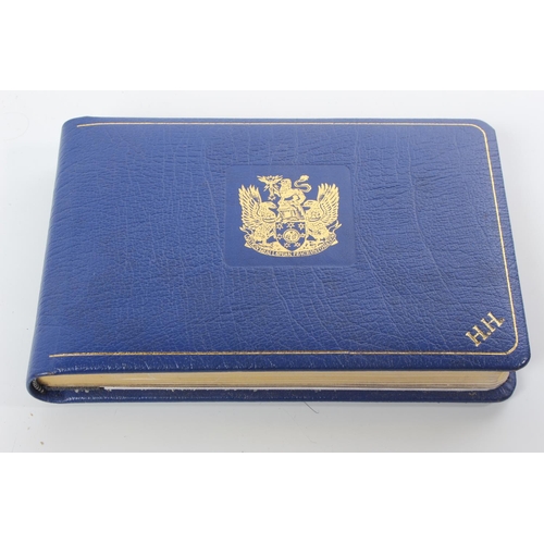 75 - An autograph album and contents.