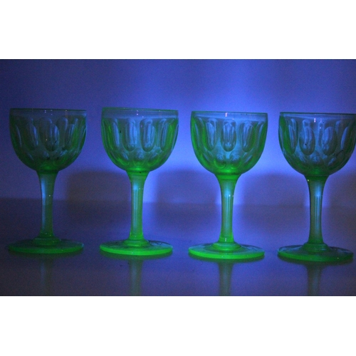 93 - A set of four vintage uranium liqueur glasses.