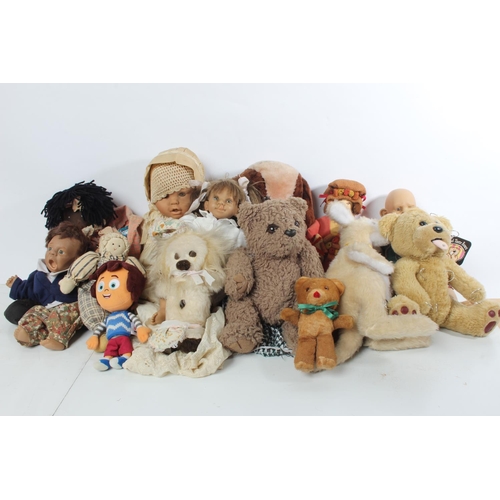 125 - A large lot of vintage dolls and soft toys.