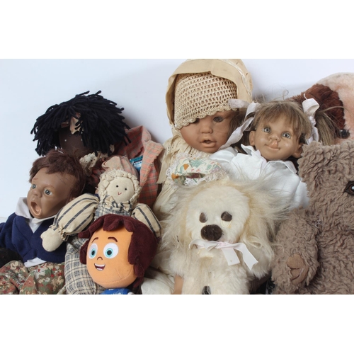 125 - A large lot of vintage dolls and soft toys.