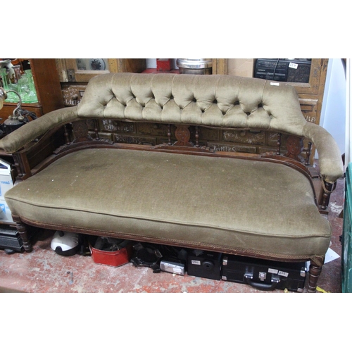 126 - An antique upholstered window settee.