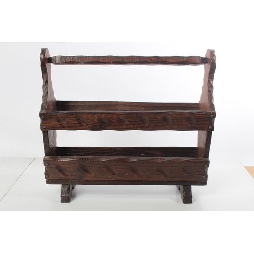 148 - A vintage oak magazine rack.