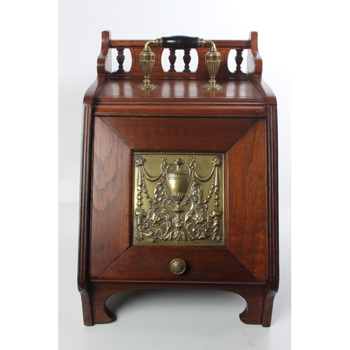 163 - A stunning antique mahogany coal box with brass panel and original liner.