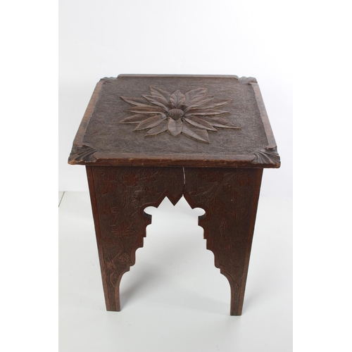 167 - An antique oak carved stool/table.