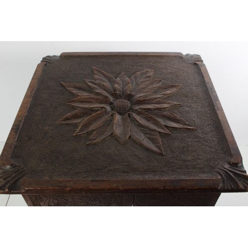 167 - An antique oak carved stool/table.