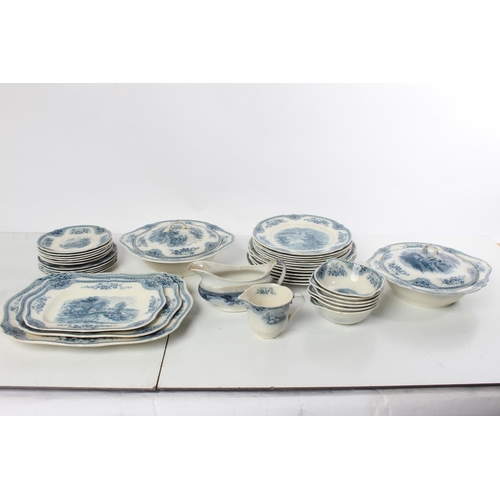 171 - An antique blue and white patterned dinner set to include two lidded tureens, a set of three platter... 