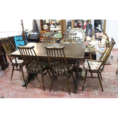 175 - A stunning vintage Ercol dining room table and six chair set.